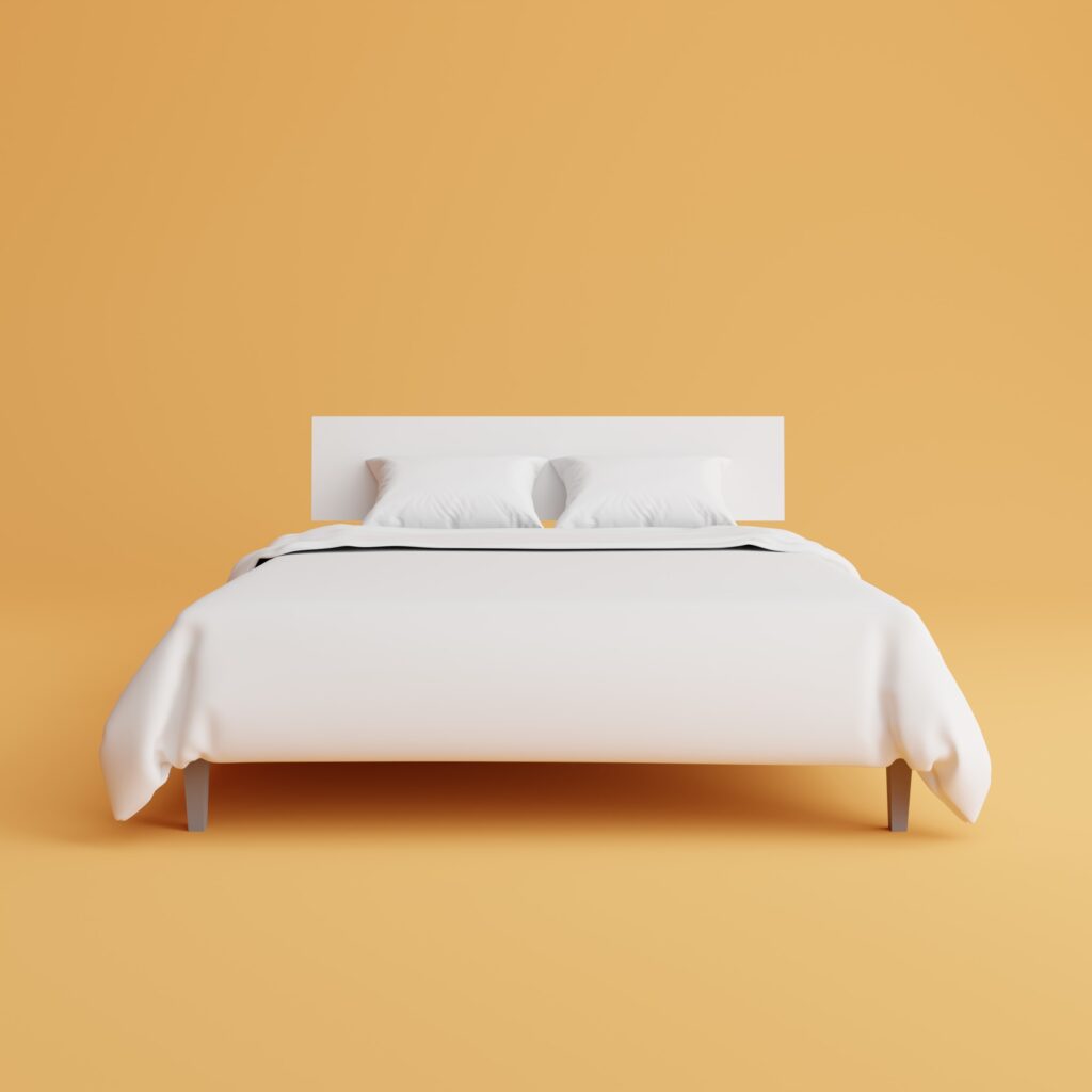 a bed with white sheets and pillows