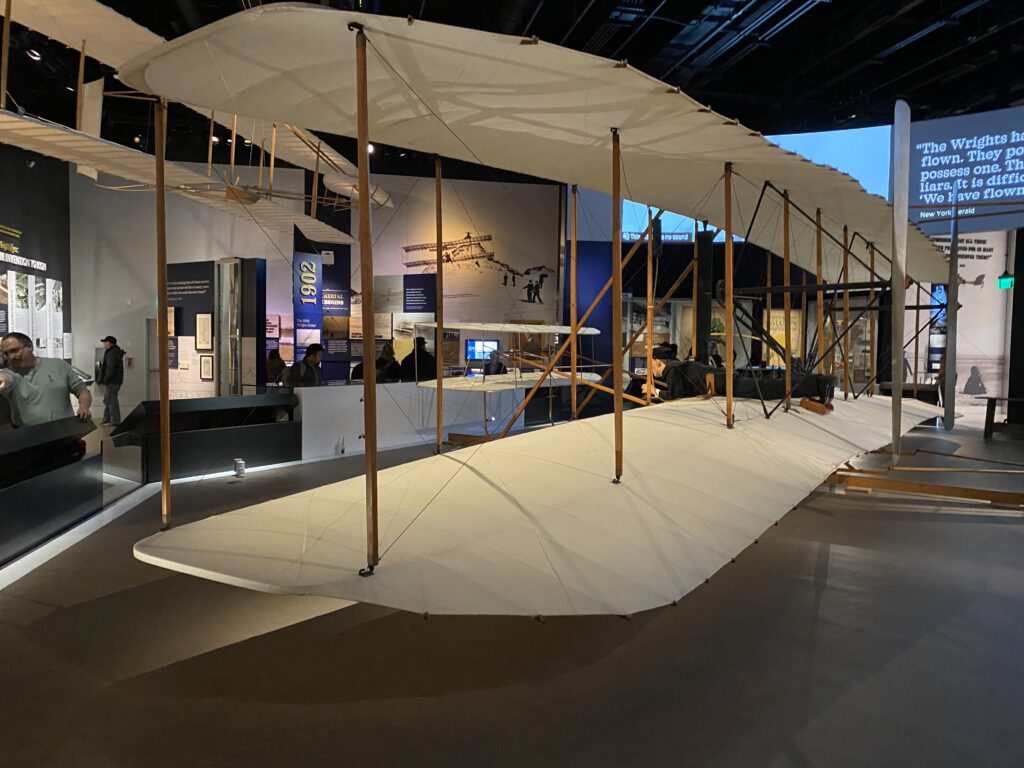 a white airplane in a museum