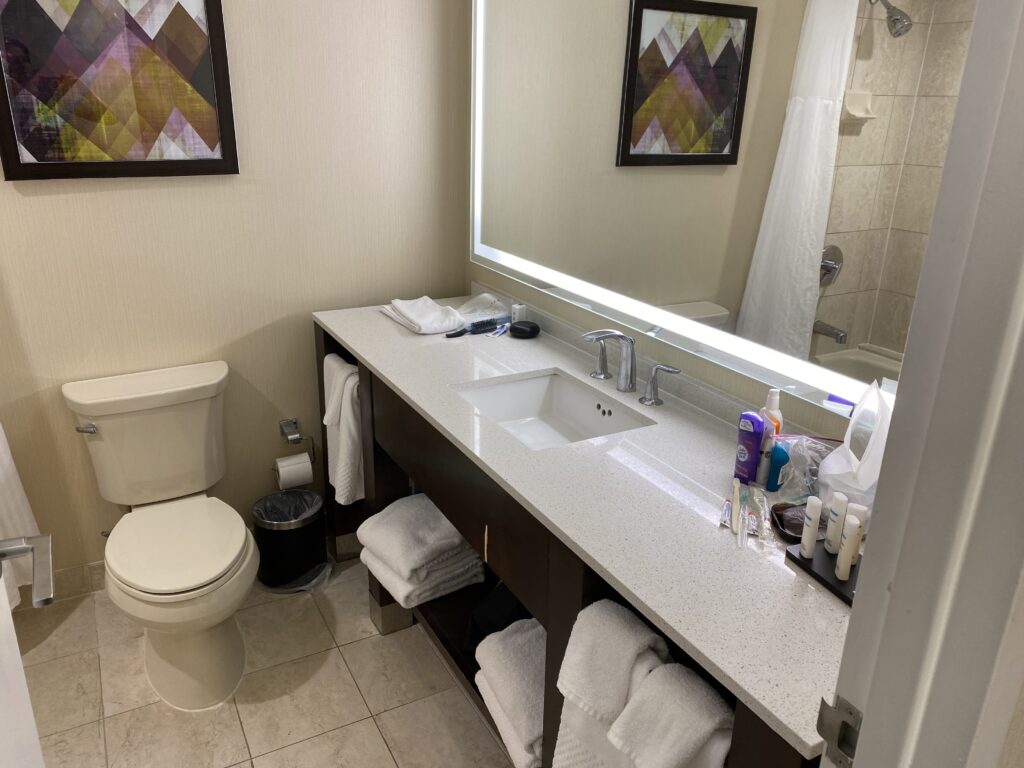a bathroom with a mirror and sink