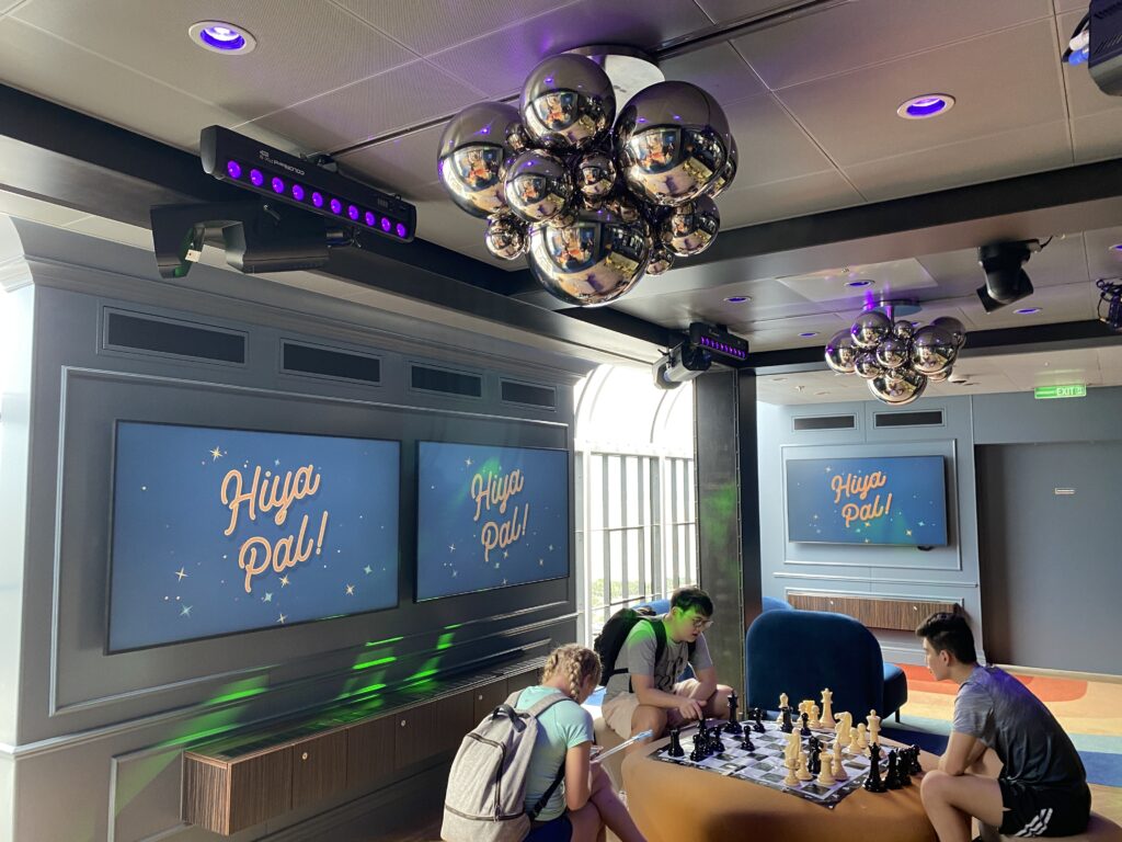 a group of people playing chess in a room