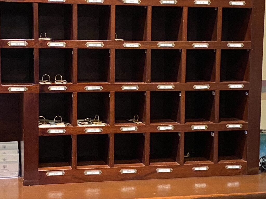 a wooden shelf with small shelves