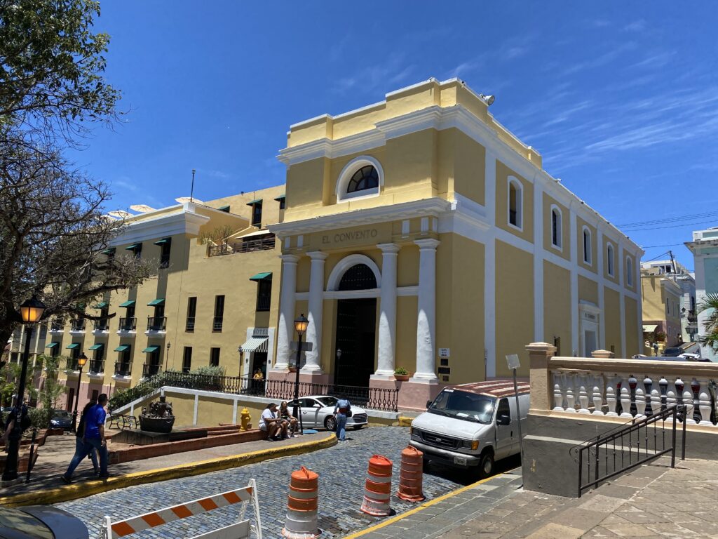 a yellow building with columns and columns