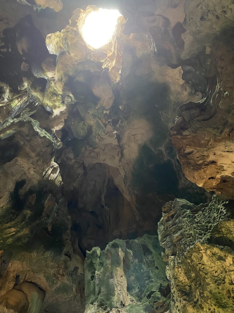 a cave with a light shining through