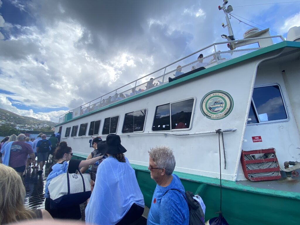 a group of people standing next to a boat