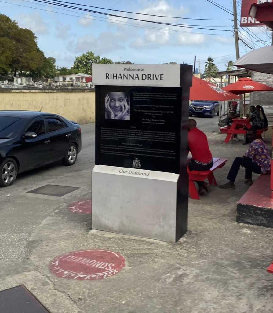 a sign with a woman's face on it