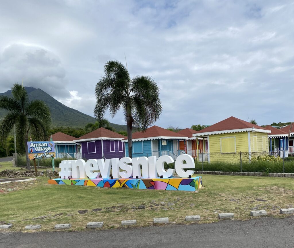a sign in front of a row of houses