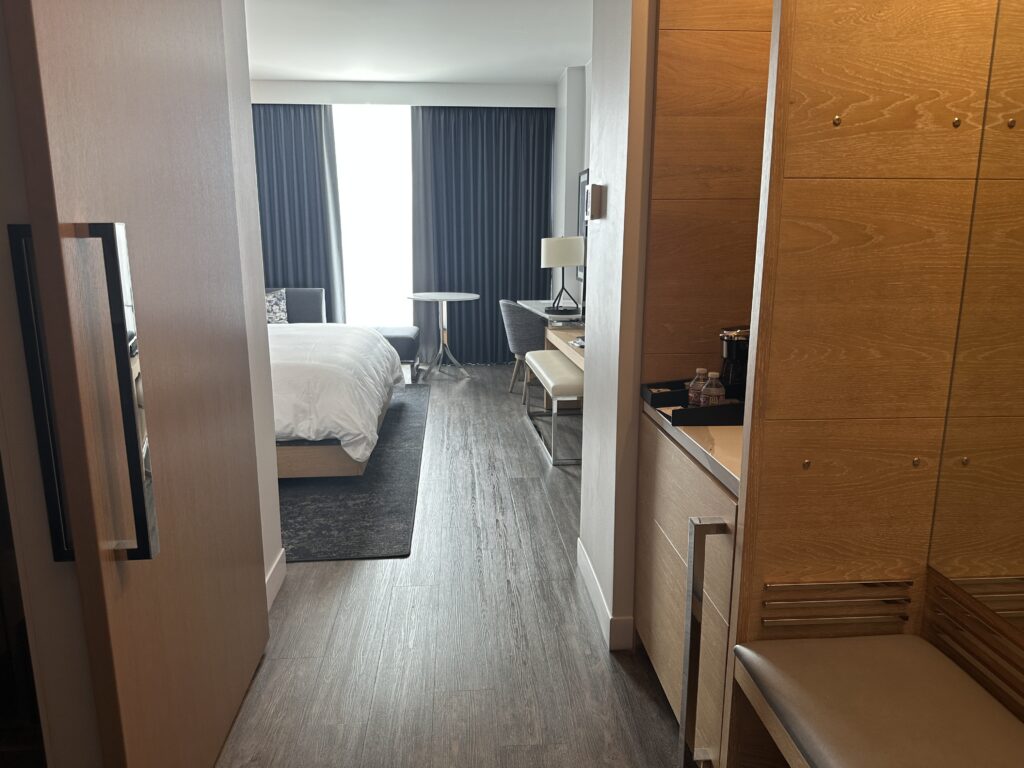 a bedroom with a bed and a table