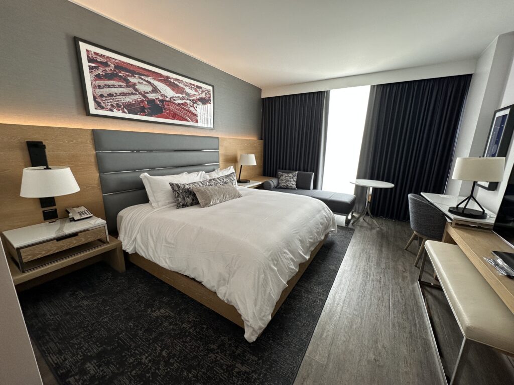 a bedroom with a bed and a desk