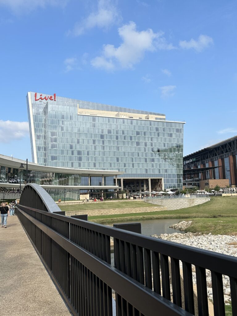 a bridge over a river with a large building