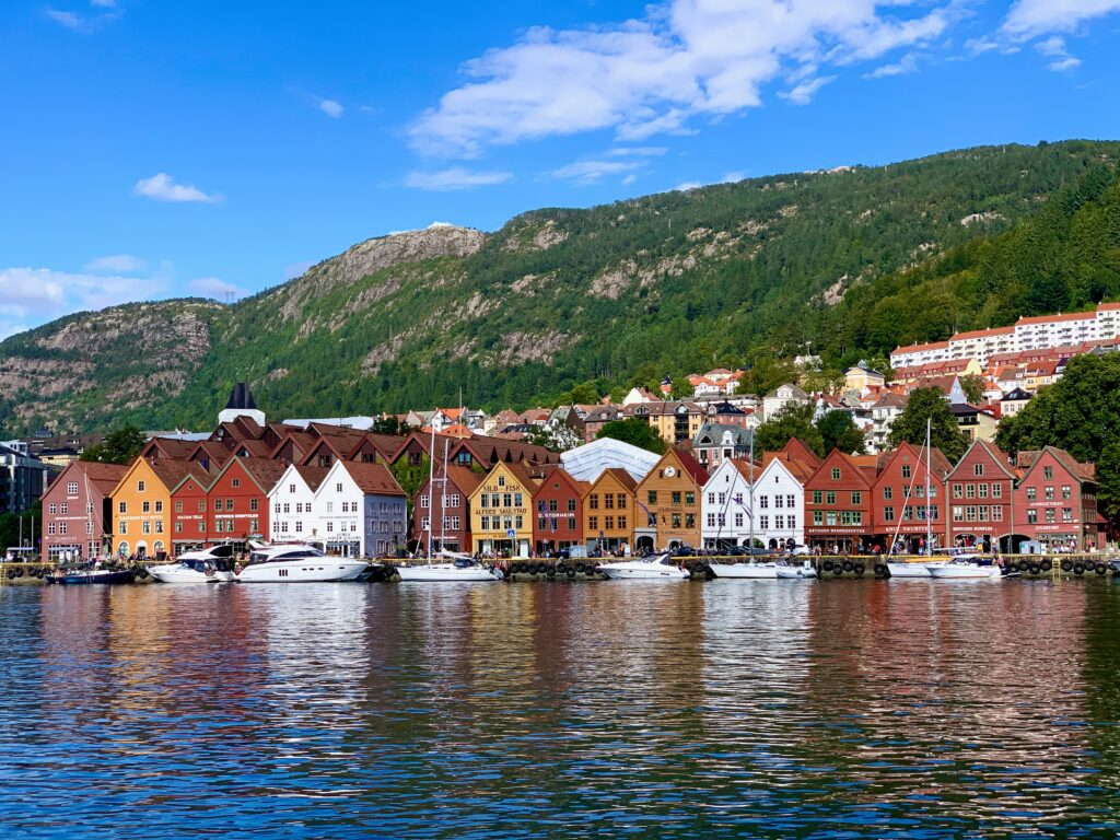 a row of colorful buildings next to a body of water