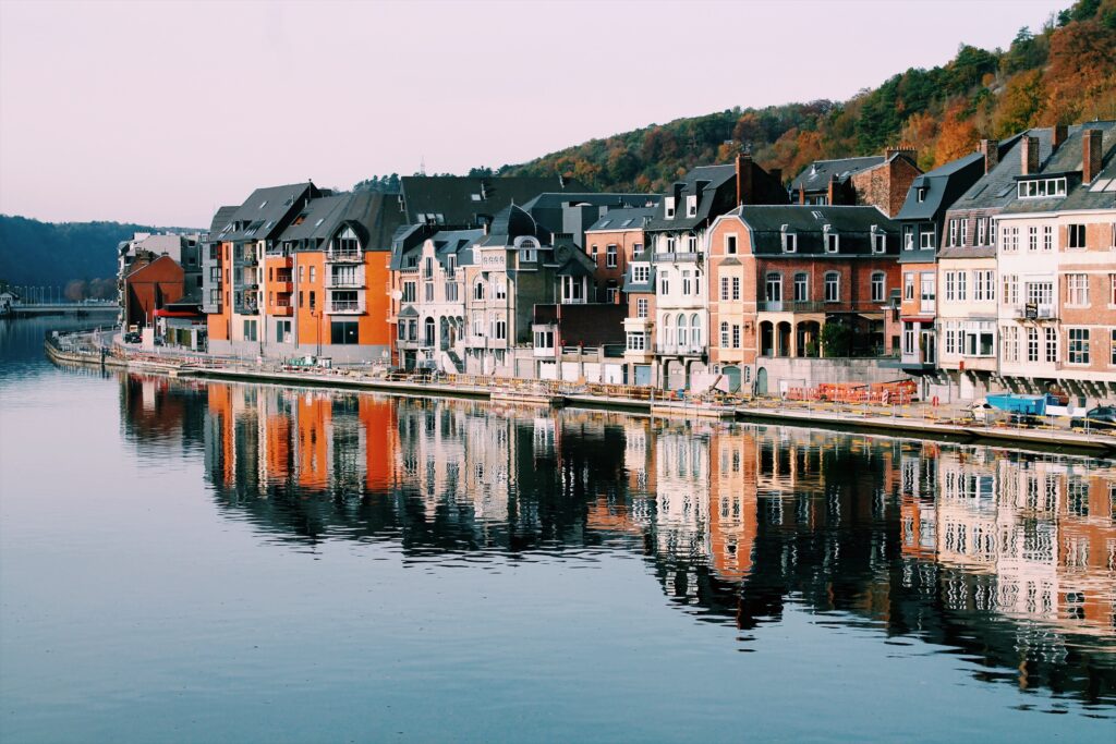 a row of buildings next to a body of water