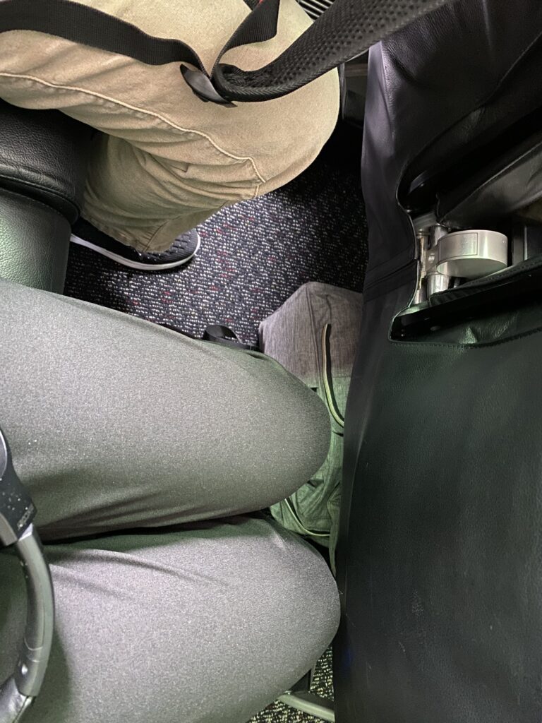 a person's legs in a seat