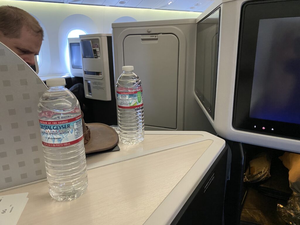 a person sitting on a chair in an airplane