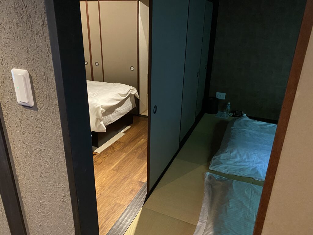 a bedroom with a mirror and bed