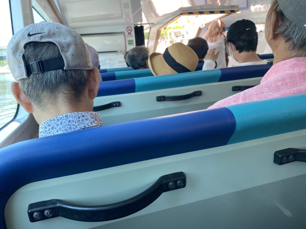 a group of people sitting on a bus