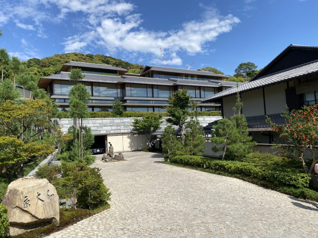 a building with trees and bushes around it