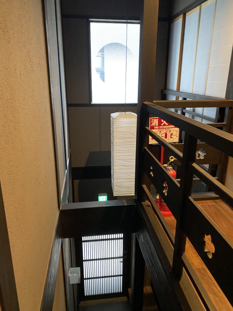 a staircase with a fire extinguisher