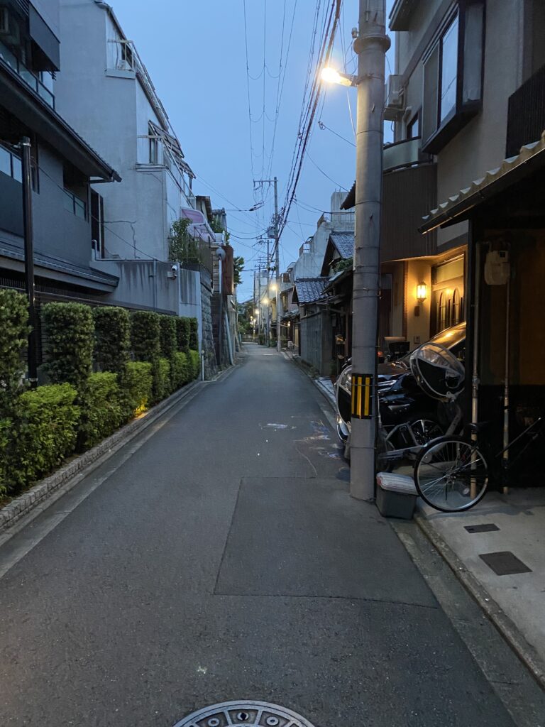 a street with buildings and a bike parked on it