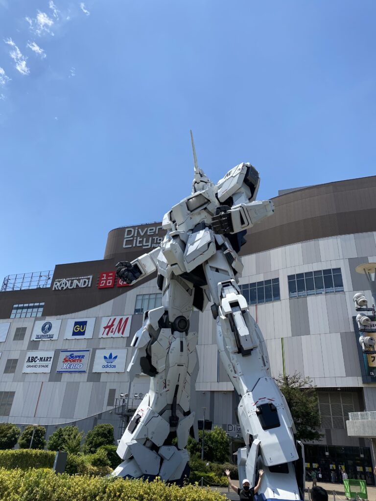 a large robot in front of a building