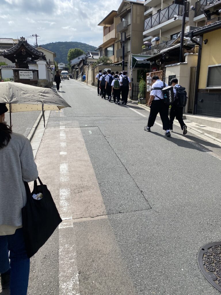 a group of people walking down a street