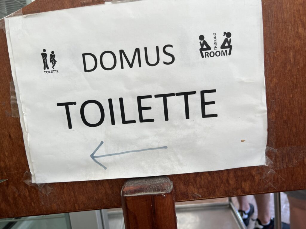 a sign on a wooden board