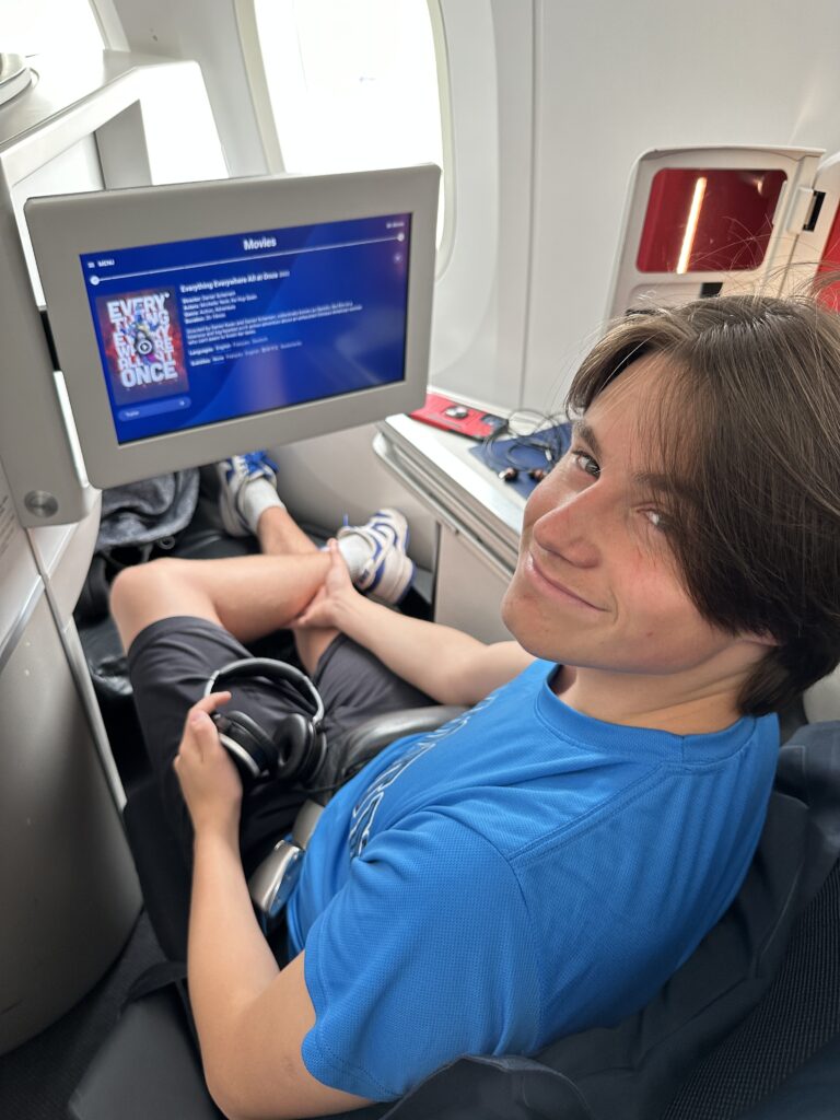 a man sitting in a chair with a computer screen
