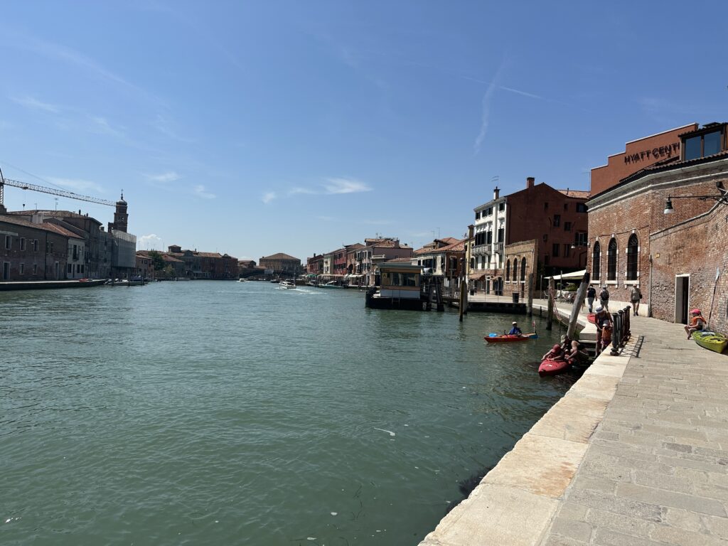 a water way with boats and buildings on the side