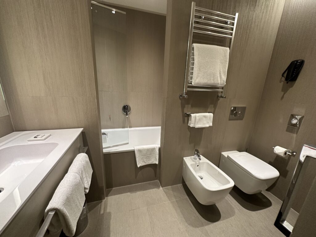 a bathroom with a tub and toilet