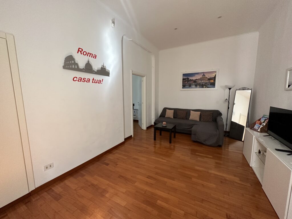 a room with a couch and a wood floor