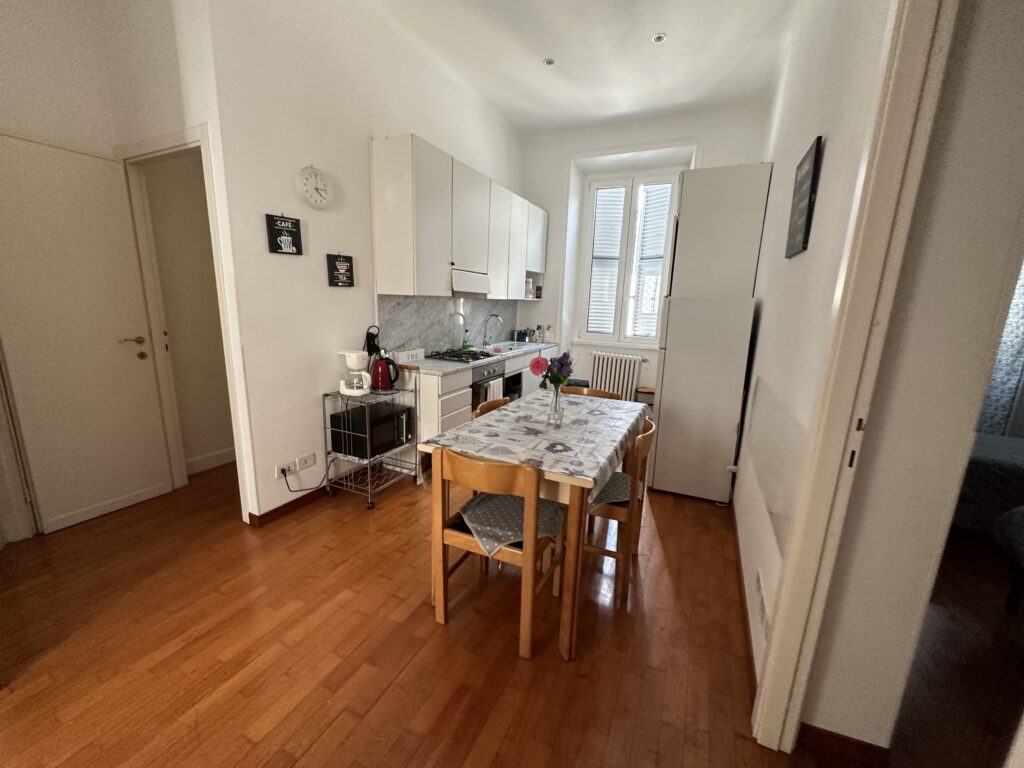 a kitchen with a table and chairs