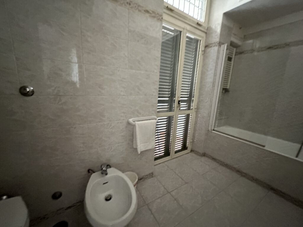 a bathroom with a toilet and shower