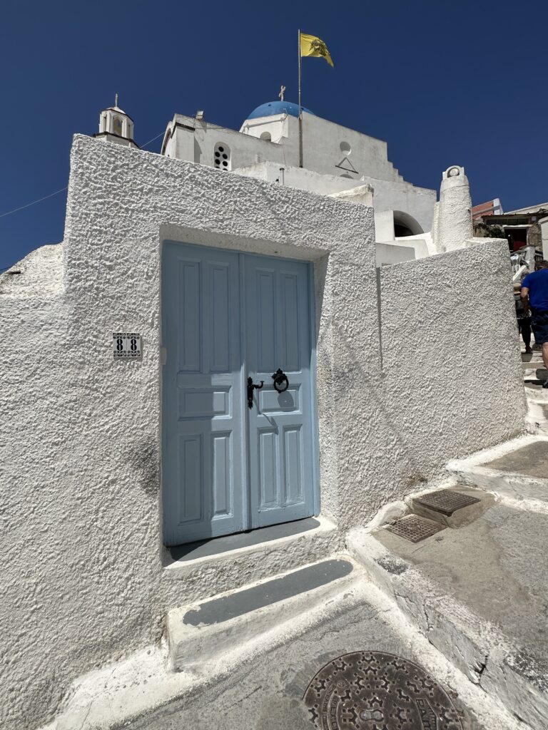 a blue door in a white building