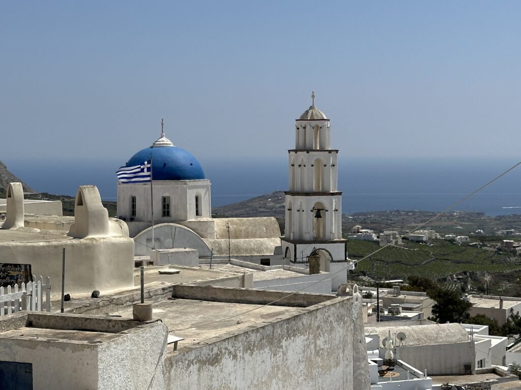 a white buildings with a blue dome and a blue roof