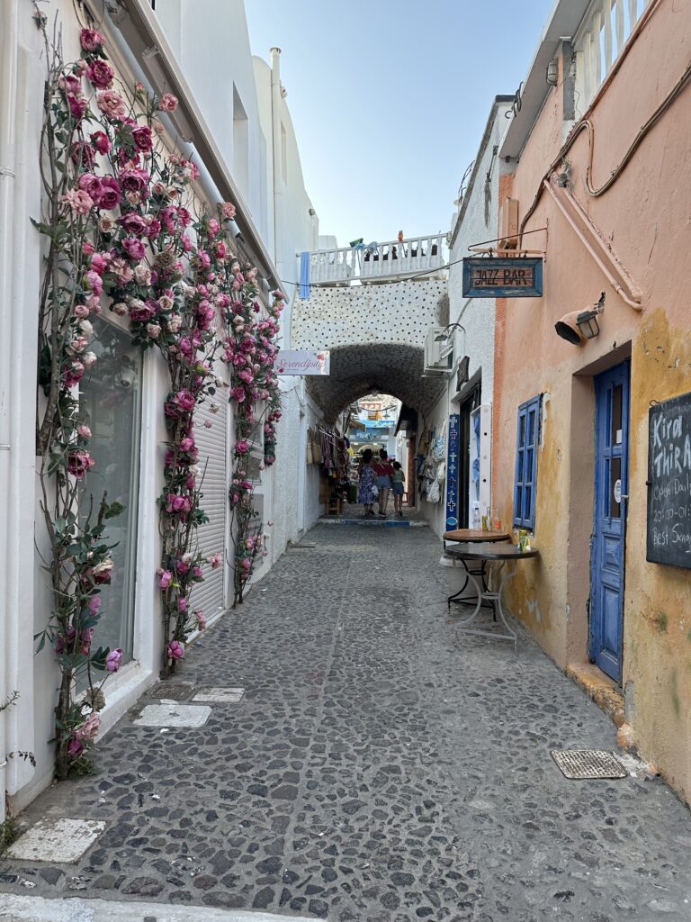 a street with flowers on the side