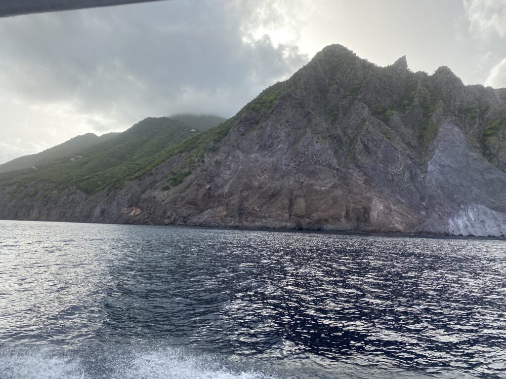 a body of water with a large mountain in the distance