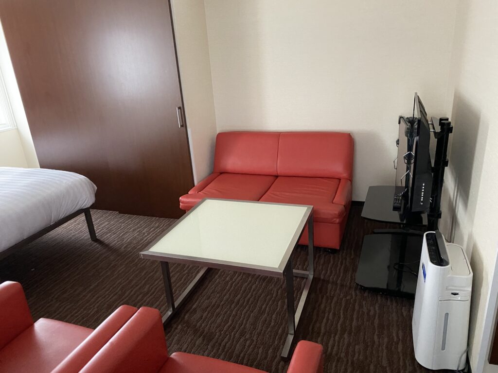 a room with a couch and tv