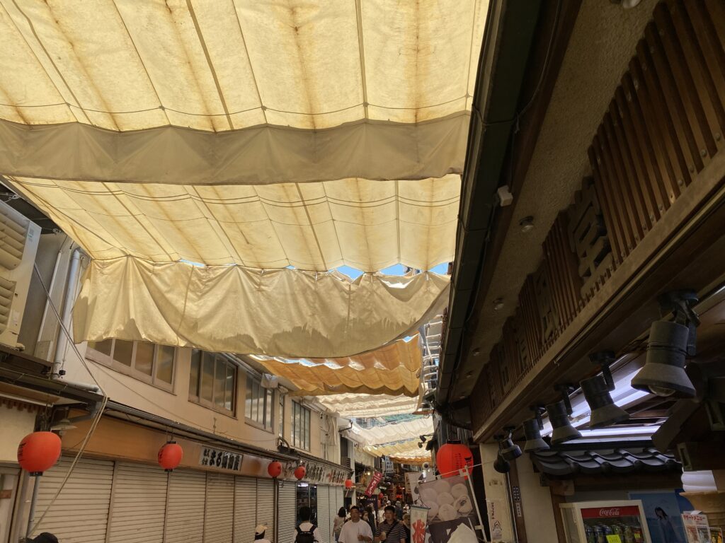 a group of people walking in a market