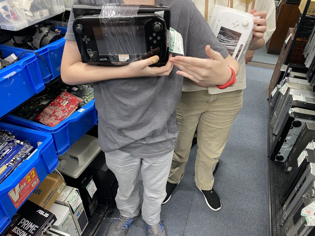 a person holding a video game console