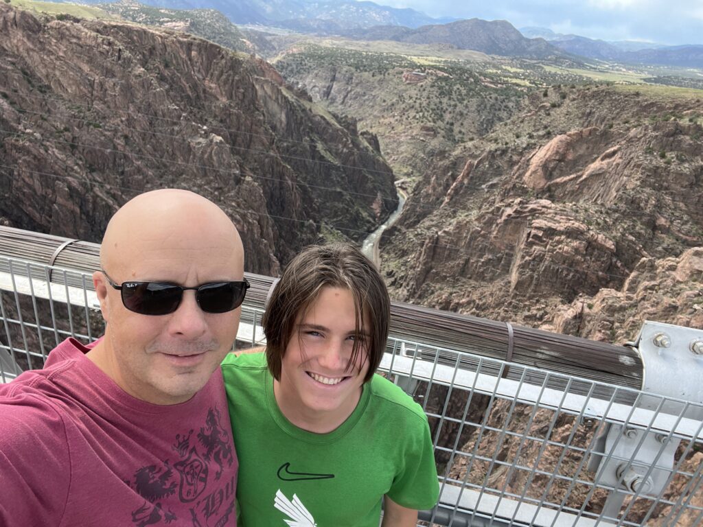 a man and boy posing for a picture