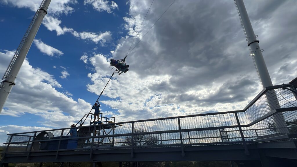 a person from a rope over a bridge