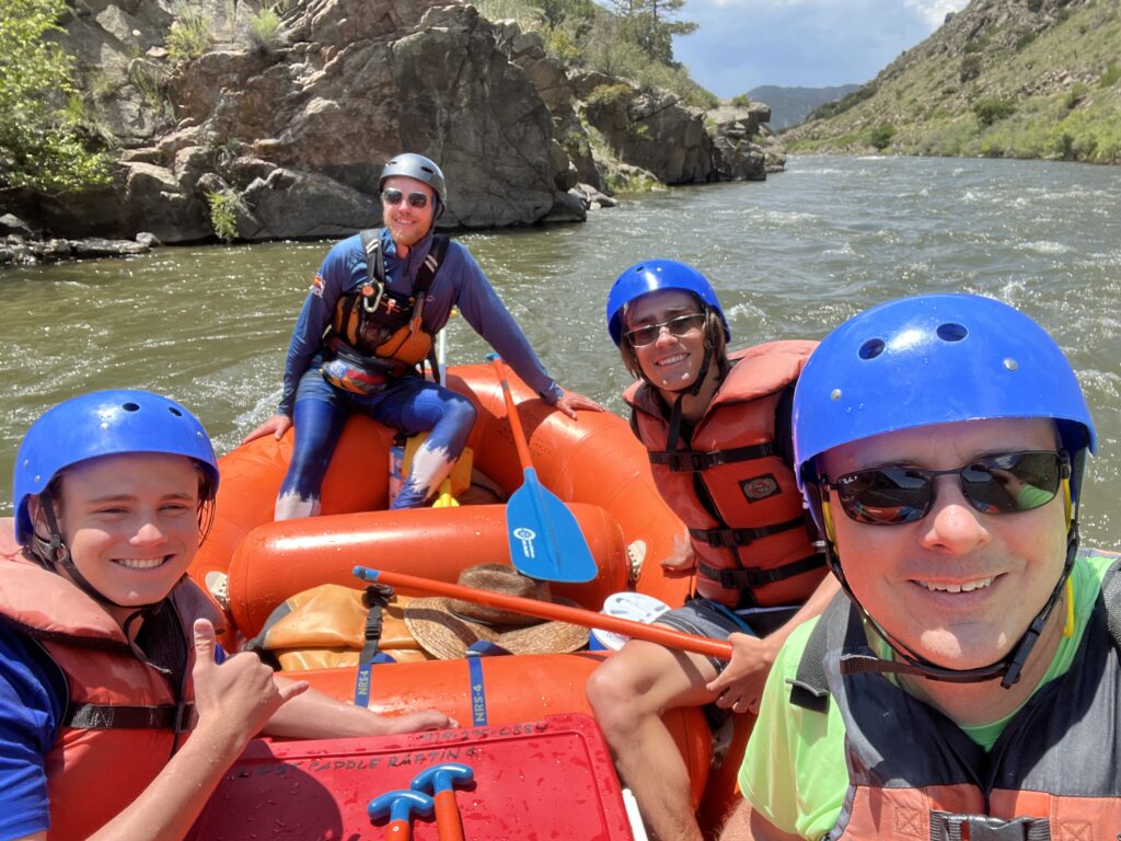 a group of people on a raft