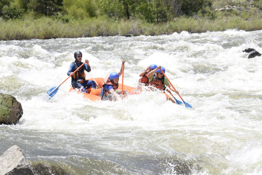 a group of people in a raft