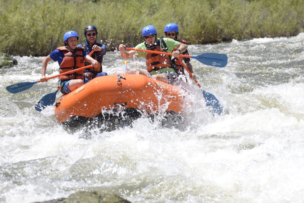 a group of people in a raft