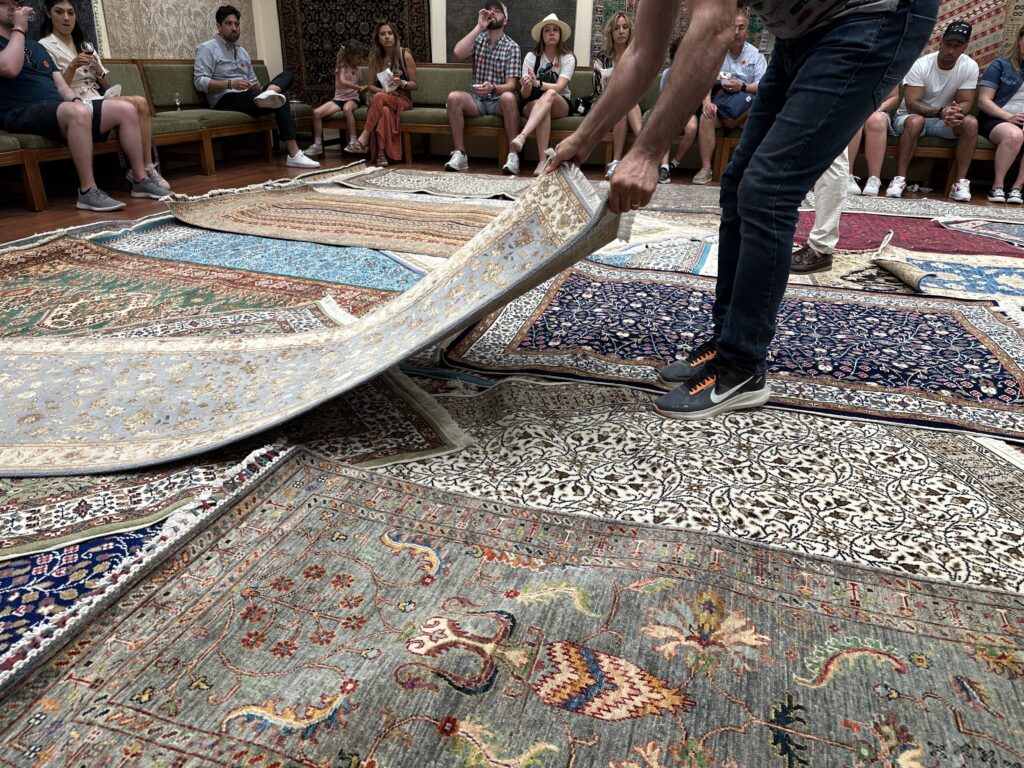 a man holding a rug
