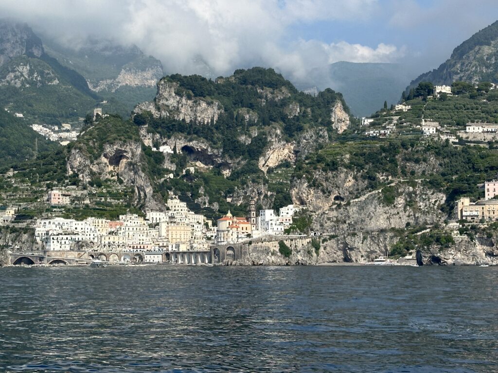 a city on a hill by a body of water