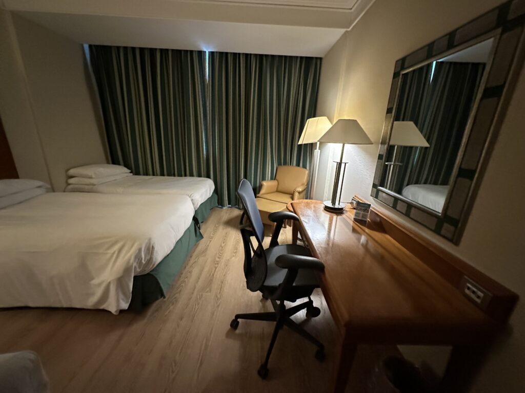 a room with a bed and a desk