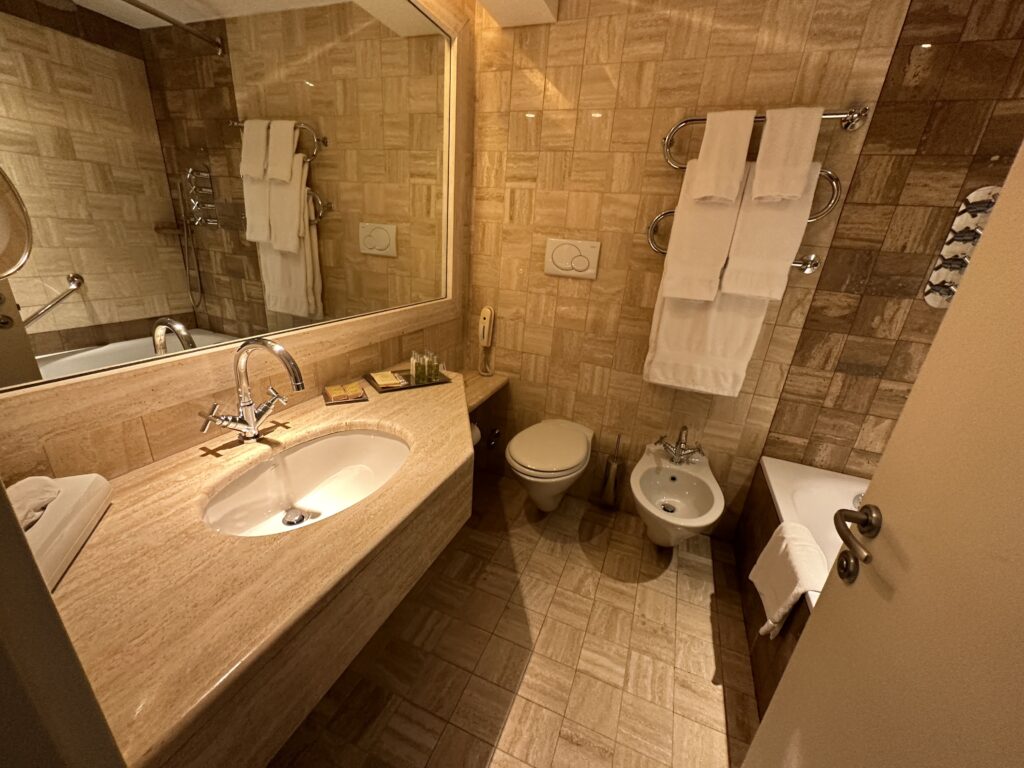 a bathroom with a sink toilet and toilet