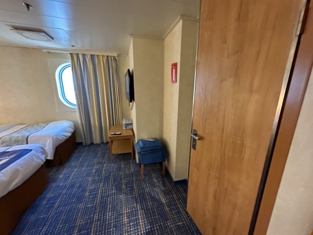 a room with a door and a bed