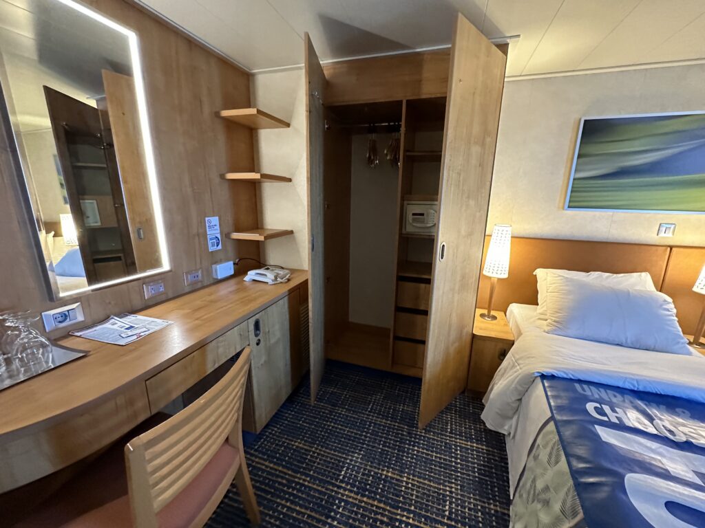 a room with a bed and a desk