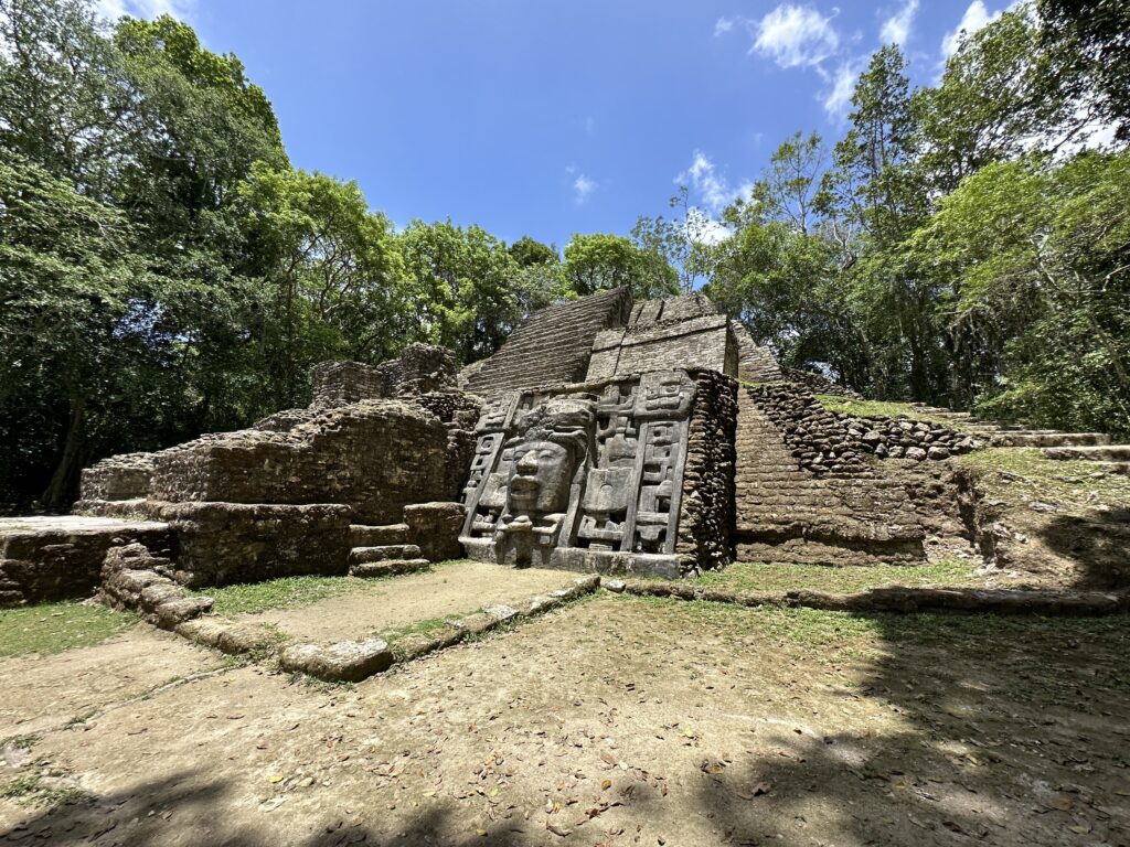 a stone structure with a face carved into it
